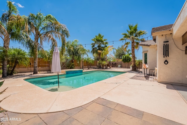 view of swimming pool featuring a patio area and a fenced backyard
