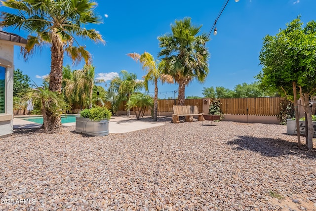 fenced backyard with a patio