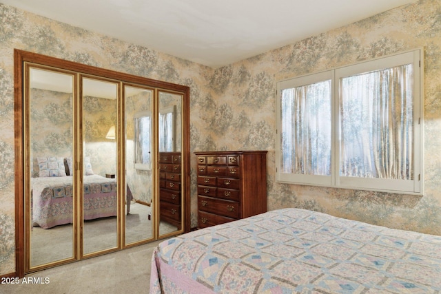carpeted bedroom featuring wallpapered walls