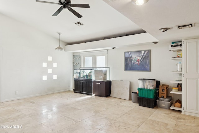 living room featuring a ceiling fan and lofted ceiling