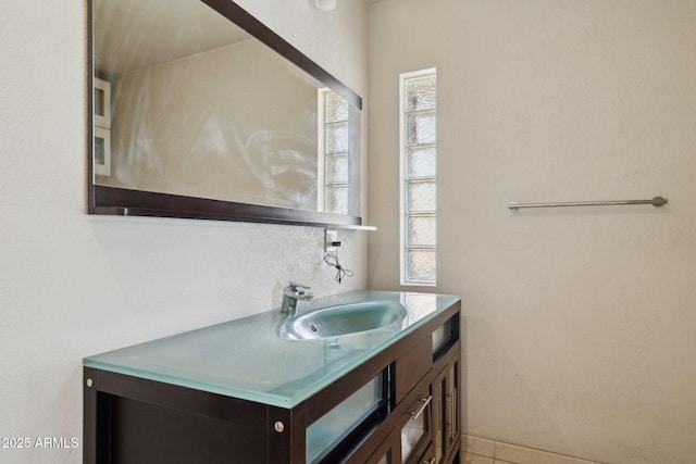 bathroom with healthy amount of natural light and vanity