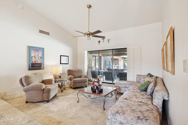 living room featuring ceiling fan and high vaulted ceiling