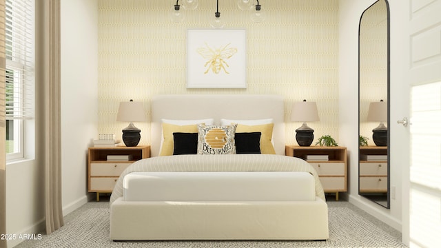 bedroom with baseboards, wallpapered walls, and carpet