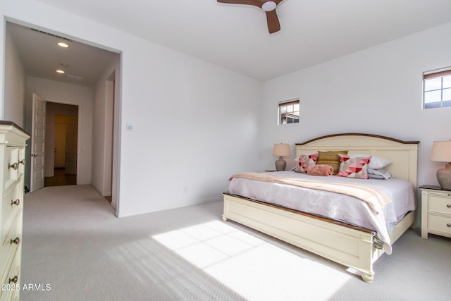 bedroom featuring ceiling fan and light carpet