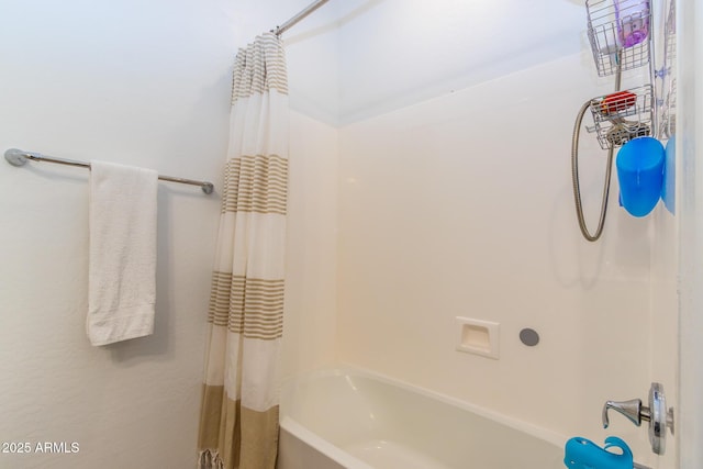 bathroom with shower / tub combo with curtain