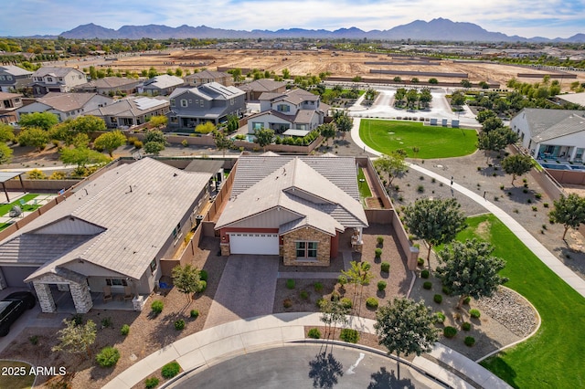 birds eye view of property with a mountain view