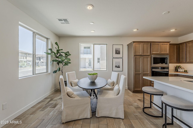 2121 W Sonoran Desert Dr Unit 86, Phoenix, AZ 85085 - dining space featuring light wood-style flooring and recessed lighting