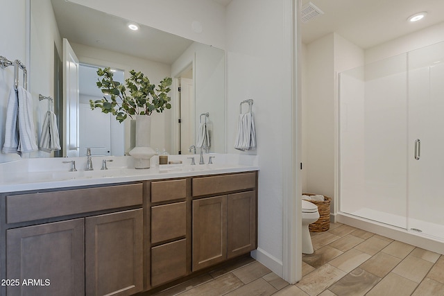 2121 W Sonoran Desert Dr Unit 86, Phoenix, AZ 85085 - bathroom with double vanity, a stall shower, and recessed lighting