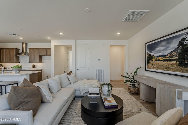 2121 W Sonoran Desert Dr Unit 86, Phoenix, AZ 85085 - living room with light wood-type flooring and recessed lighting