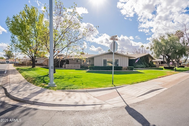 ranch-style house with a front lawn