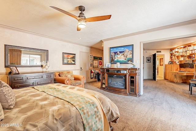 carpeted bedroom with a textured ceiling, crown molding, and ceiling fan