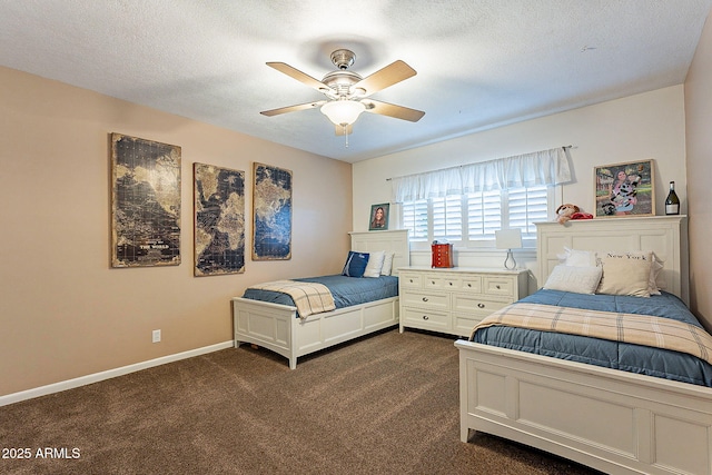 bedroom featuring dark carpet, ceiling fan, and a textured ceiling