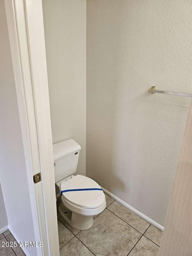 4613 W Fawn Dr, Laveen, AZ 85339 - bathroom with tile patterned flooring, baseboards, and toilet