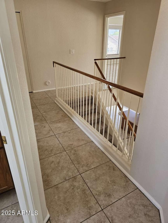 4613 W Fawn Dr, Laveen, AZ 85339 - staircase featuring tile patterned floors and baseboards