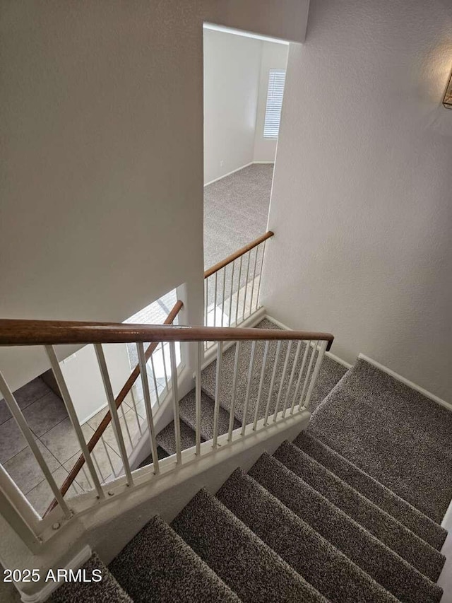 4613 W Fawn Dr, Laveen, AZ 85339 - stairway featuring carpet floors and baseboards