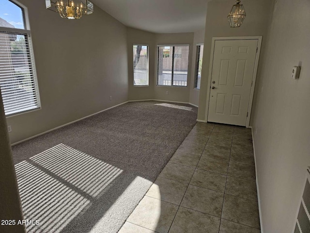 4613 W Fawn Dr, Laveen, AZ 85339 - foyer featuring baseboards, tile patterned floors, a notable chandelier, and a healthy amount of sunlight