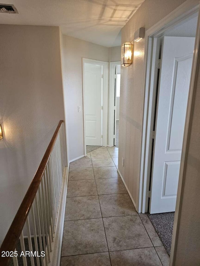 4613 W Fawn Dr, Laveen, AZ 85339 - hallway with tile patterned floors, baseboards, and visible vents