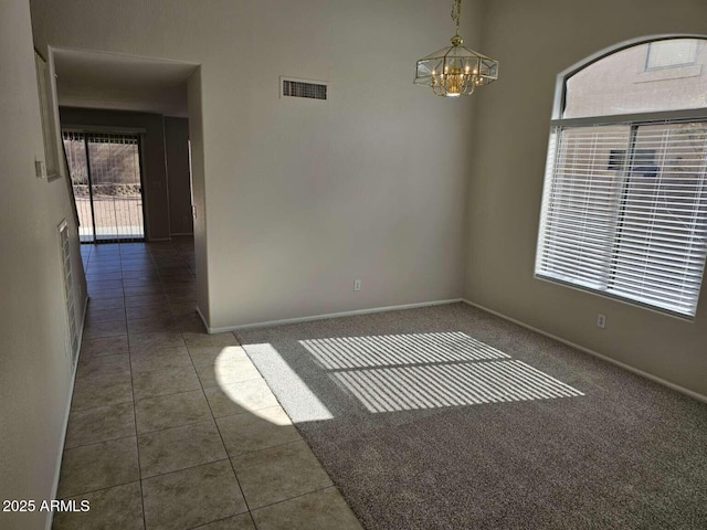 4613 W Fawn Dr, Laveen, AZ 85339 - tiled spare room with visible vents, baseboards, and an inviting chandelier
