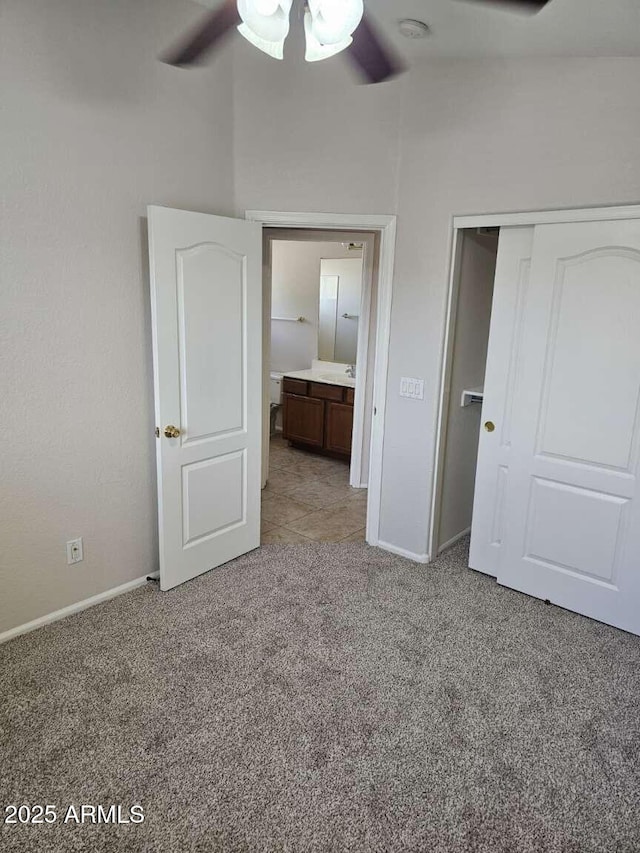 4613 W Fawn Dr, Laveen, AZ 85339 - unfurnished bedroom with carpet floors, baseboards, a closet, and ceiling fan