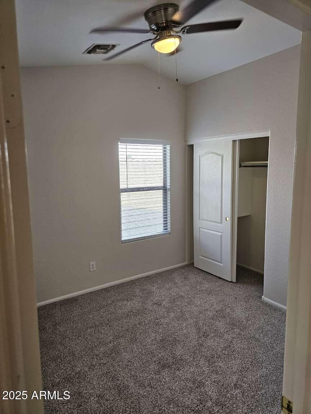 4613 W Fawn Dr, Laveen, AZ 85339 - unfurnished bedroom with carpet, baseboards, vaulted ceiling, visible vents, and a closet