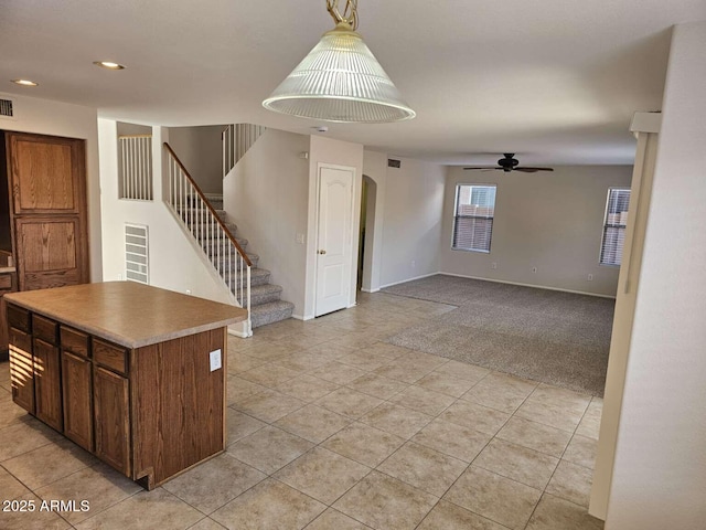 4613 W Fawn Dr, Laveen, AZ 85339 - interior space with a ceiling fan, visible vents, arched walkways, stairway, and light tile patterned floors