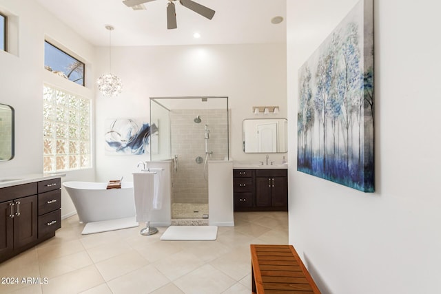 bathroom featuring tile patterned flooring, vanity, separate shower and tub, and ceiling fan