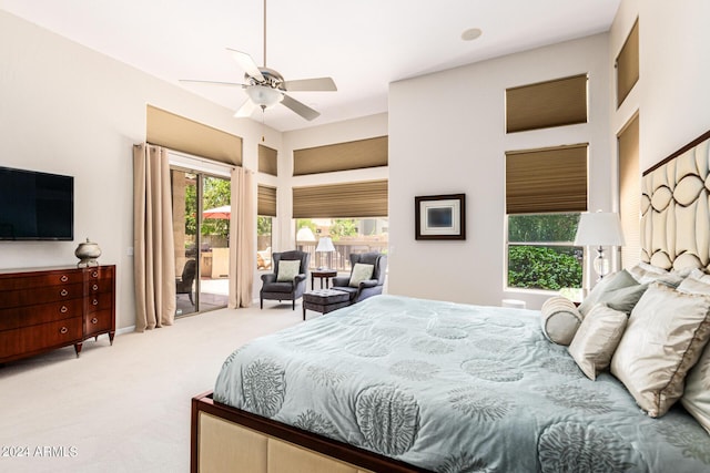 carpeted bedroom with access to exterior and ceiling fan