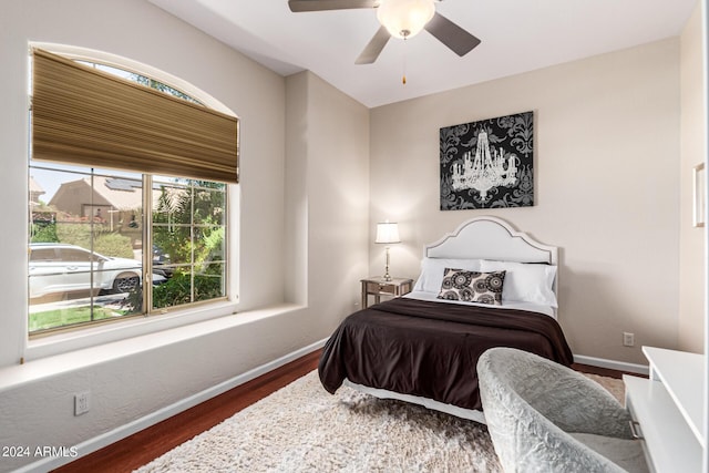 bedroom featuring dark hardwood / wood-style flooring and ceiling fan