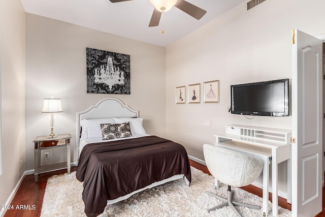 bedroom with ceiling fan and hardwood / wood-style flooring