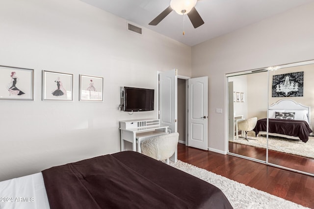 bedroom featuring ceiling fan, a closet, and dark hardwood / wood-style floors