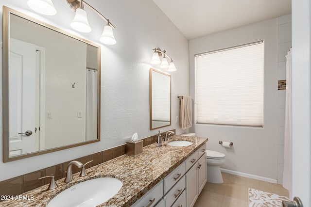 bathroom featuring tile patterned flooring, vanity, toilet, and a shower with shower curtain