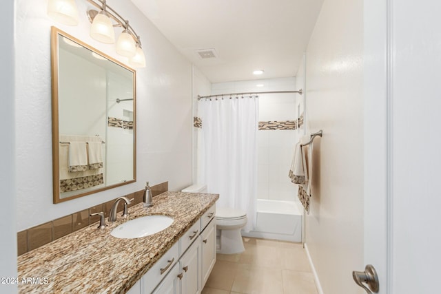 full bathroom with tile patterned flooring, shower / bath combination with curtain, toilet, and vanity