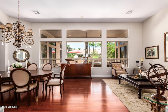 dining room featuring a chandelier and dark hardwood / wood-style floors