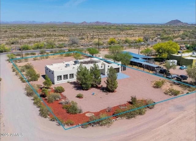 drone / aerial view with a desert view and a mountain view