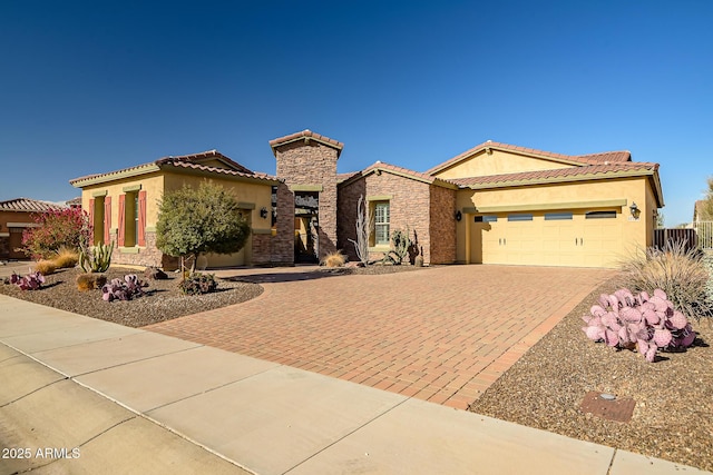 mediterranean / spanish house featuring a garage