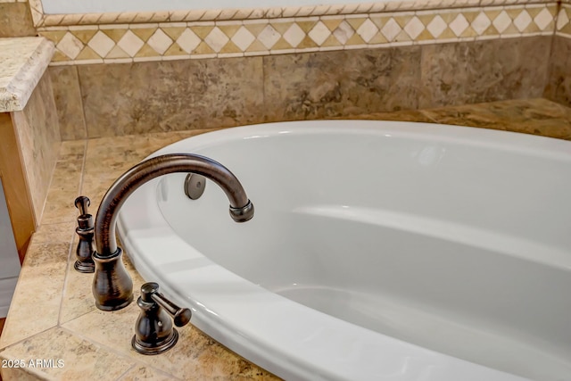 room details with a relaxing tiled tub and sink