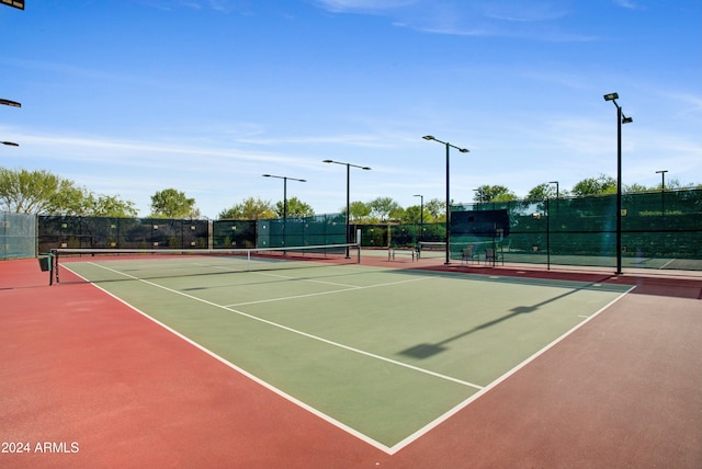 view of tennis court featuring basketball court