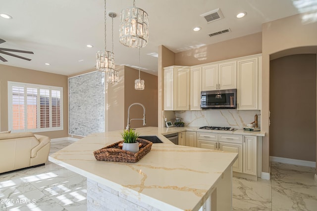 kitchen featuring visible vents, decorative backsplash, appliances with stainless steel finishes, marble finish floor, and recessed lighting