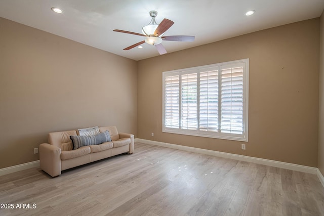 unfurnished room featuring ceiling fan, recessed lighting, wood finished floors, and baseboards