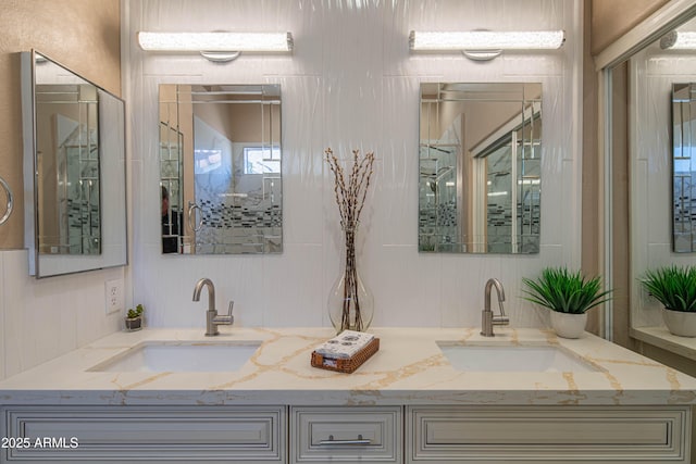 bathroom with double vanity and a sink