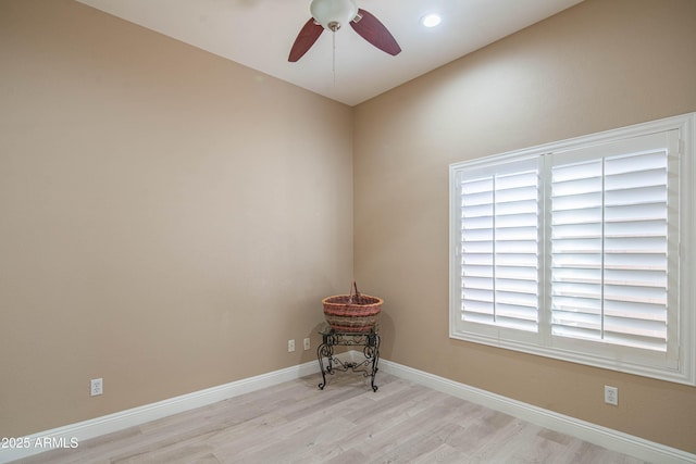 unfurnished room featuring ceiling fan, baseboards, wood finished floors, and recessed lighting