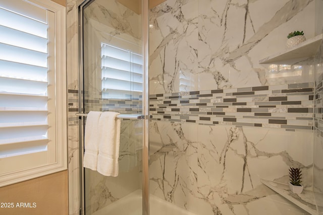 full bathroom with bath / shower combo with glass door