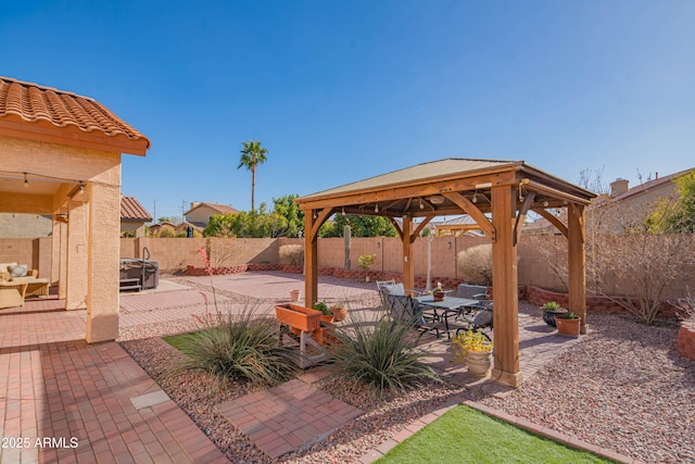 view of patio / terrace featuring a fenced backyard and a gazebo