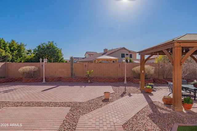 view of patio / terrace with a gazebo and a fenced backyard