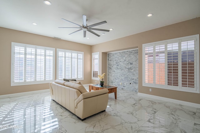 living room with marble finish floor, baseboards, a ceiling fan, and recessed lighting