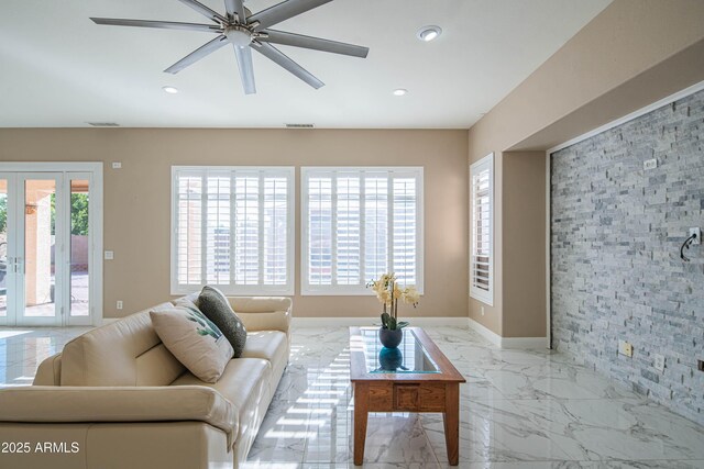 living room featuring visible vents, baseboards, a ceiling fan, marble finish floor, and recessed lighting