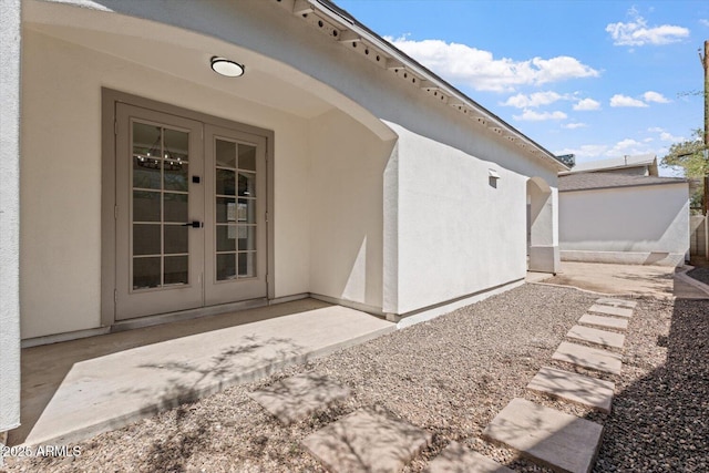 1510 W Fillmore St, Phoenix, AZ 85007 - property entrance with french doors, stucco siding, and a patio