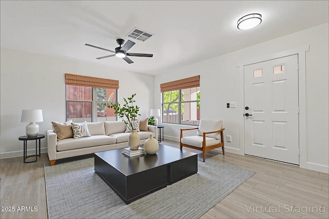 1510 W Fillmore St, Phoenix, AZ 85007 - living room featuring light wood-style flooring and ceiling fan