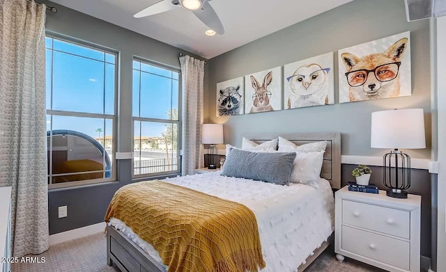 carpeted bedroom featuring ceiling fan