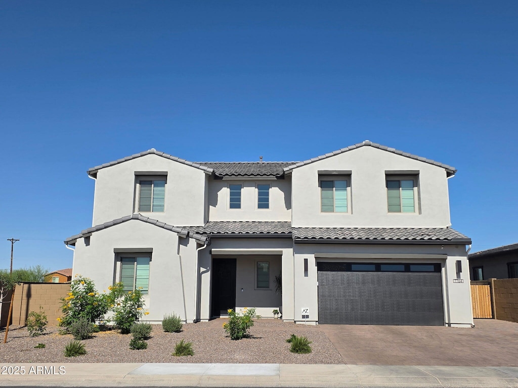 7764 S Rockwell St, Queen Creek, AZ 85142 - view of front facade with a tiled roof, an attached garage, driveway, and stucco siding